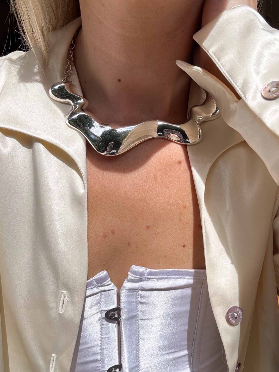 Crème de seta silk pearl button blouse