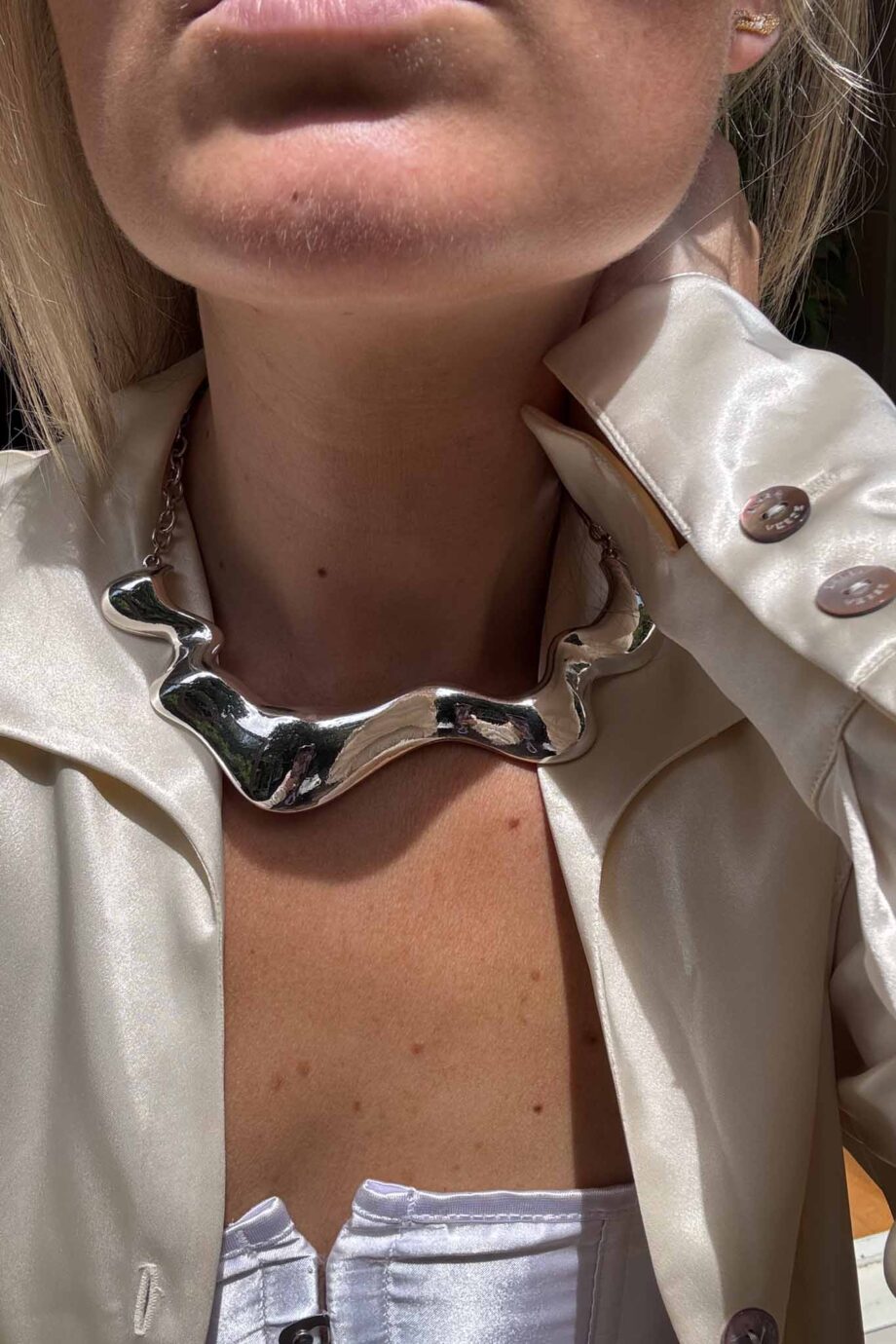 Crème de seta silk pearl button blouse