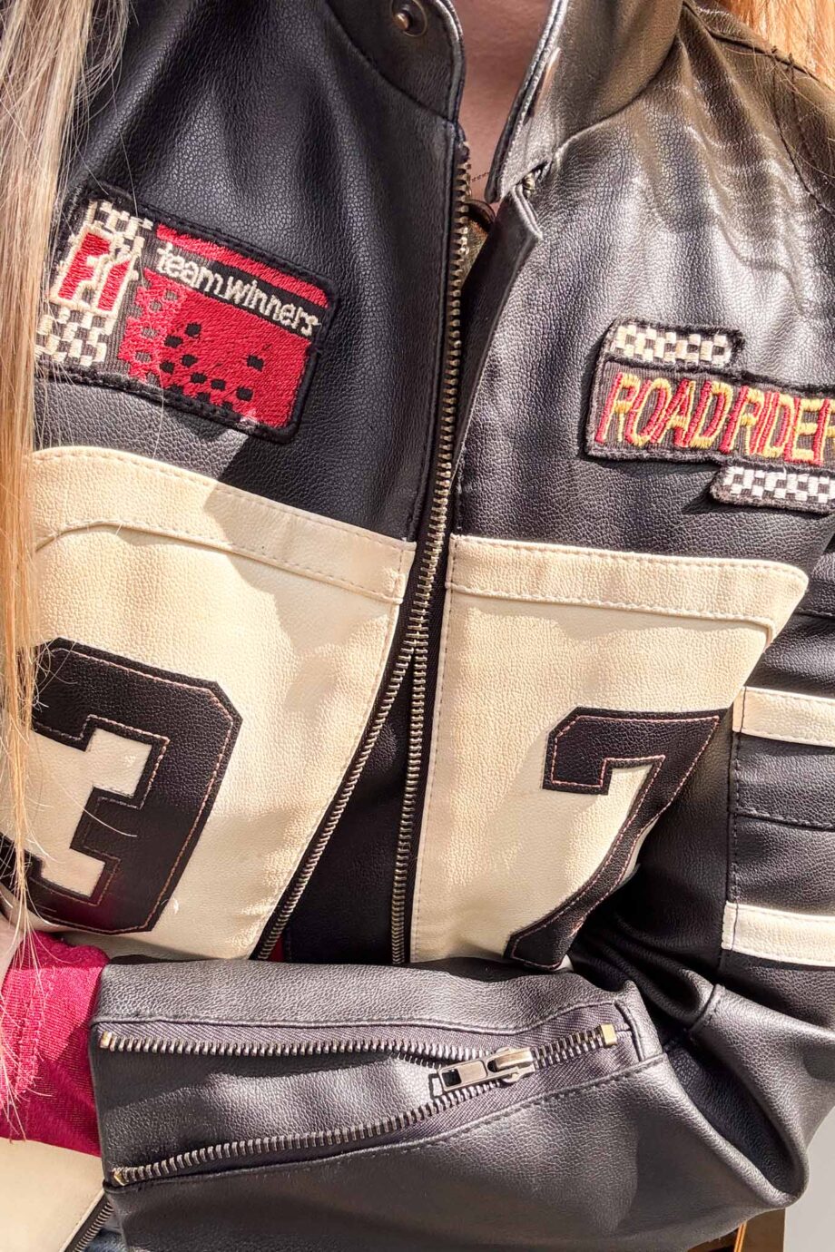 Car racing in 90s leather jacket