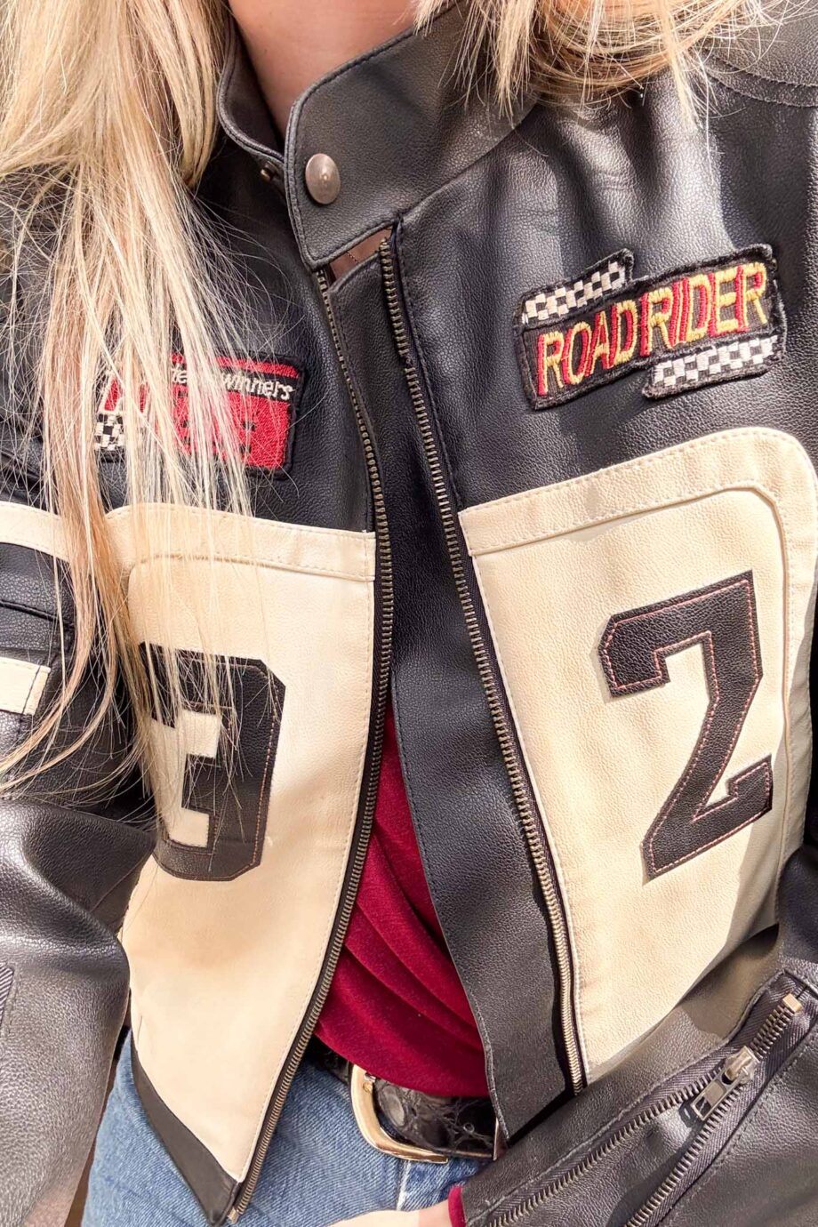 Car racing in 90s leather jacket
