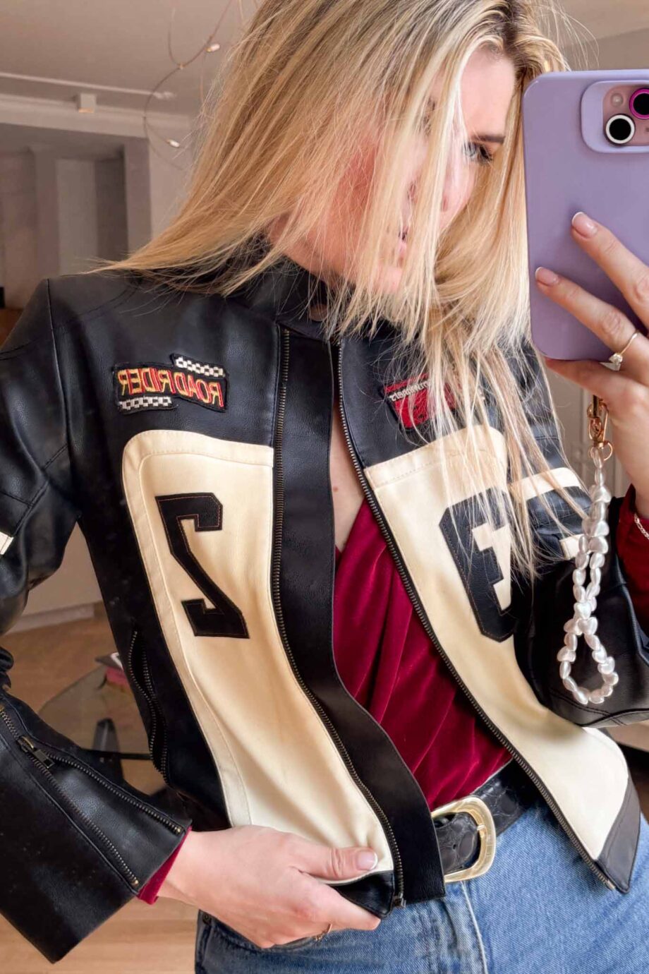 Car racing in 90s leather jacket