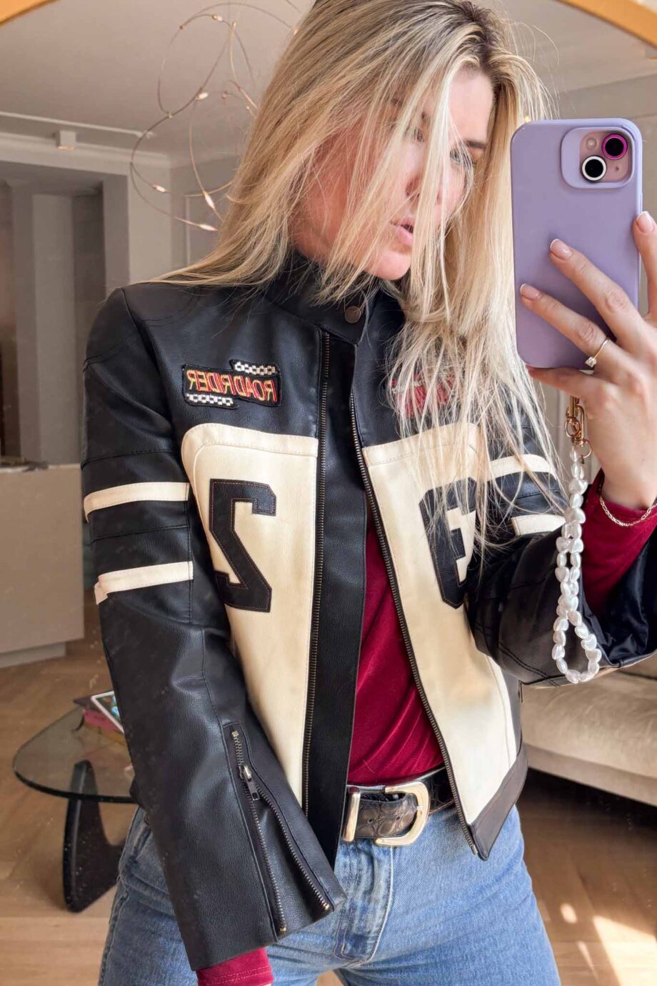 Car racing in 90s leather jacket